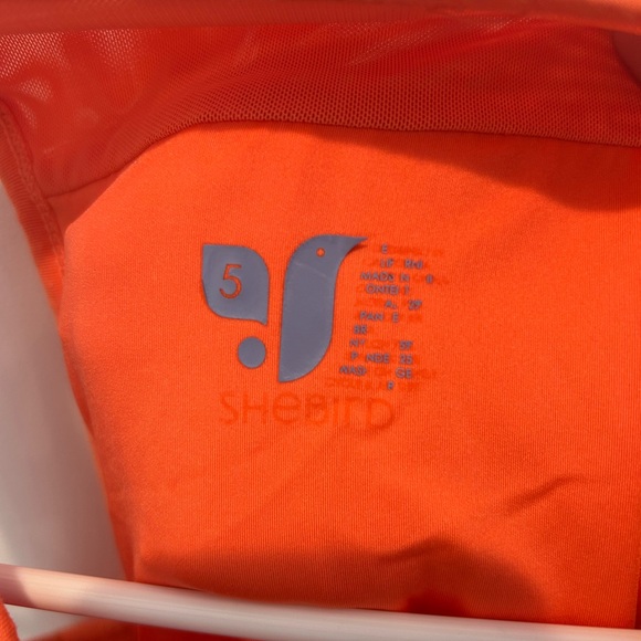 SheBird The Freedom Racerback Tank With Built in Bra in Orange - Picture 5 of 6
